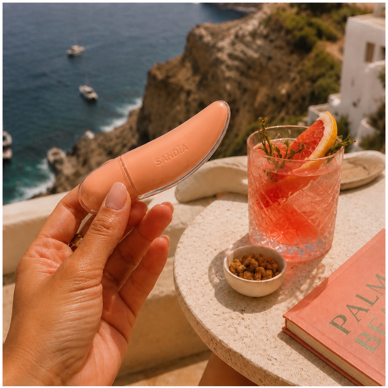 SANDÍA gloss on a table overlooking the sea