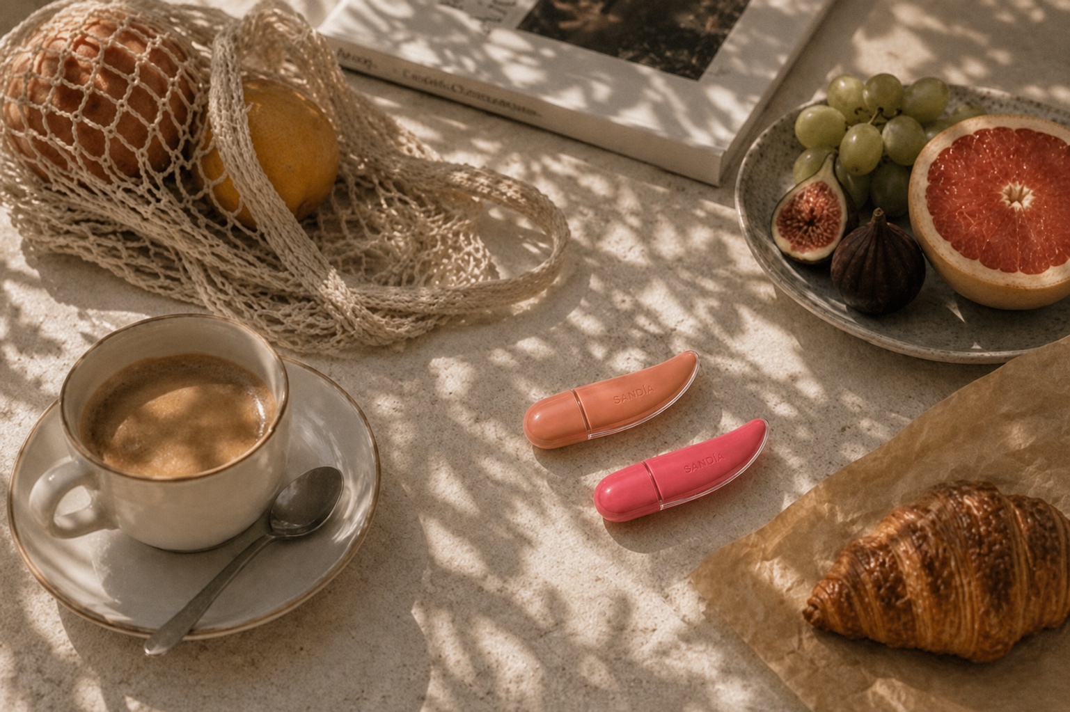 Gloss and breakfast on a sun-dappled table